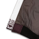 Inner view of the Wakanda Textile Jacket for Men showing brown polyester bubble lining, inner liner pocket, and neat stitching details.