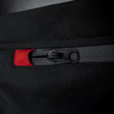 Close-up of the Thorvo Waistcoat's waterproof black coil zippers with thumb pullers for chest and waist pocket closures.