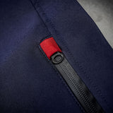 Close-up of the Thorvo Waistcoat's waterproof black coil zippers with thumb pullers for chest and waist pocket closures.