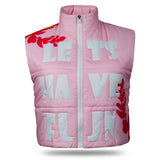 Front view of the Ladies Let’s Have Fun Cropped Waistcoat in pink, featuring 'LETS HAVE FUN' written in bold text on the chest. The waistcoat has a white Vislon zipper with a shiny silver thumb puller.